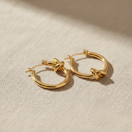 Aretes ARO NUDO dorado grueso con nudo decorativo en la base
