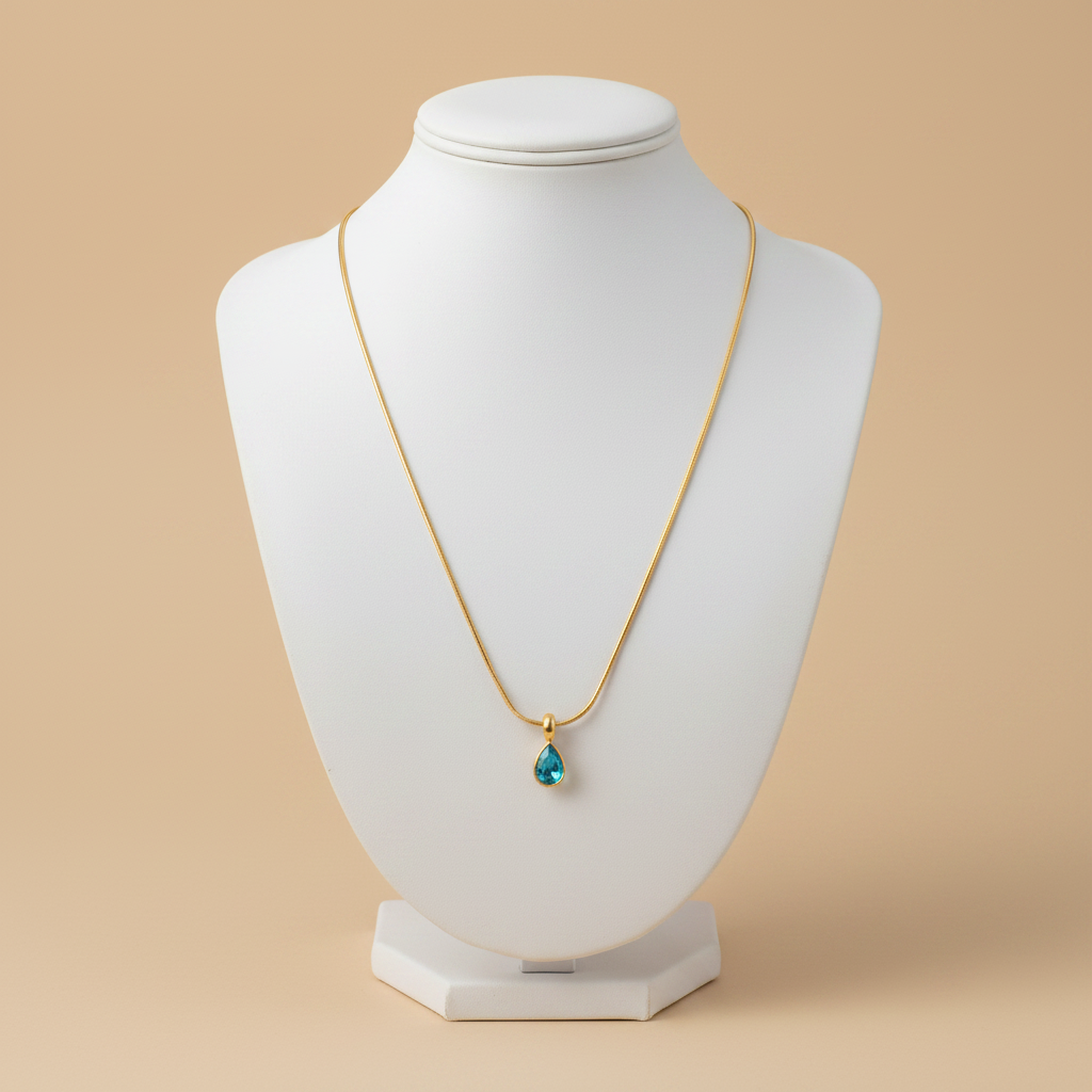 Collar GOTA AQUA cadena serpiente dorada con dije de gota en aguamarina