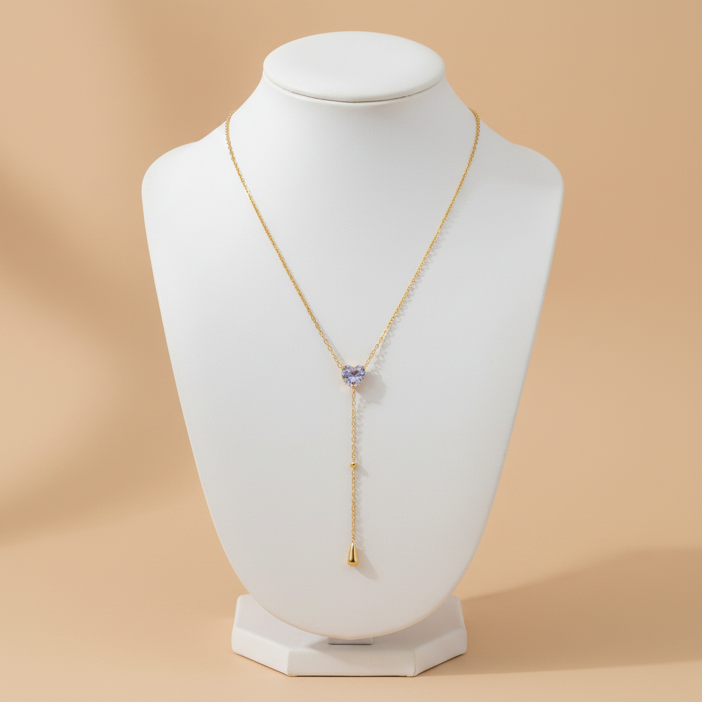 Collar LARIAT LILA dorado con corazón de zirconia lila y caída de gota dorada
