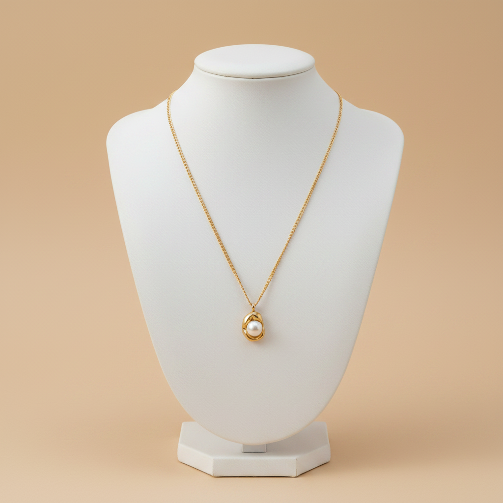 Collar NIDO cadena dorada con dije de perla en montura orgánica